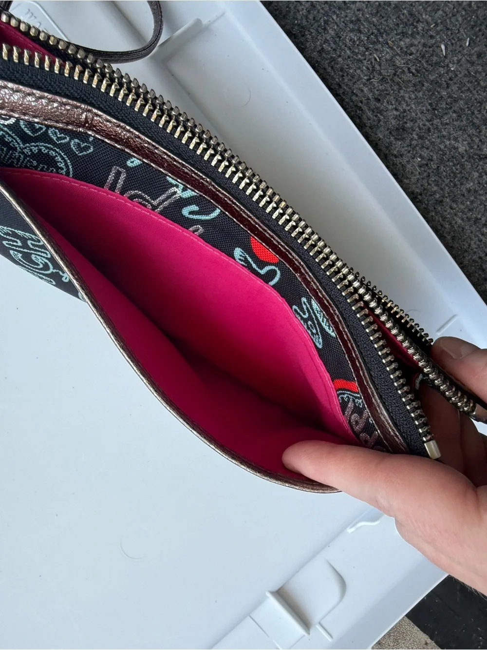 Coach Black Poppy Graffiti Print Wristlet with Bronze Trim and Red Accents